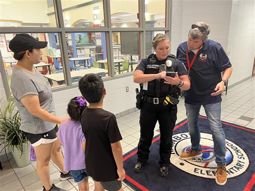 Board member Scott Newberry and SRO directing student
